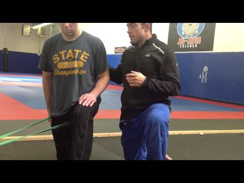 Video: pulsebeatfit.com: Hip Mobility - How to Do a Banded Hip Extension (Sam Spiegelman)