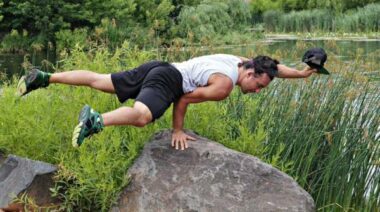 Arm balance on rock.