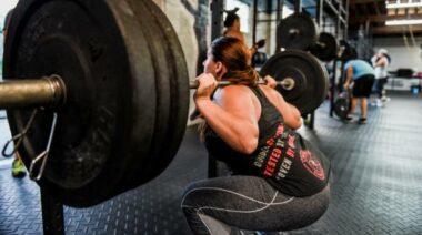 Girl with a strong back squat