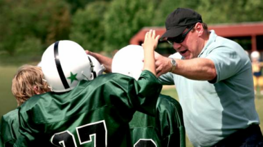 coach talking with youth