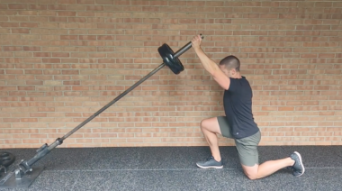 person performing kneeling shoulder press