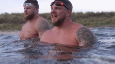 Strongmen Tom Stoltman and Luke Stoltman in the ocean