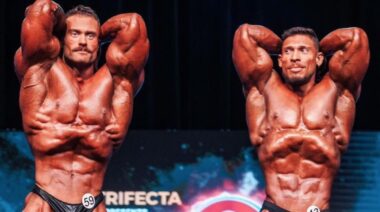 Muscular bodybuilders competing on stage