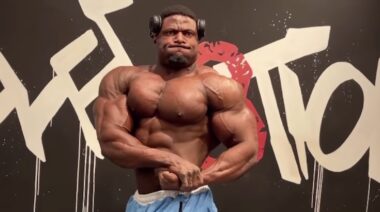 Bodybuilder Andrew Jacked posing in contest preparation