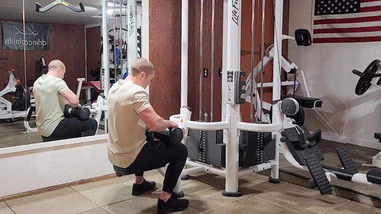 Dr. Merrick Lincoln preparing to do lat pulldown