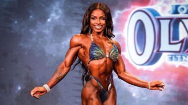 Figure Olympia champion Cydney Gillon posing on stage