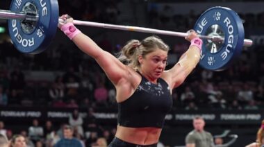 CrossFitter Ellie Turner holding barbell overhead