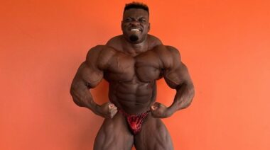 Bodybuilder Blessing Awodibu flexing muscles