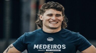 Justin Medeiros smiling, wearing name shirt, CrossFit Games