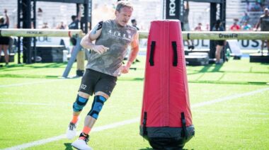 CrossFit athlete Shannon Aiken running around obstacle outdoors