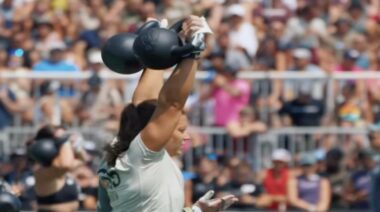 Laura Horvath lifting kettlebells overhead at 2023 CrossFit Games