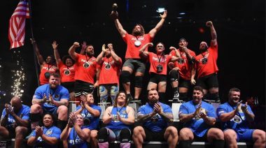 Team USA and Team UK take a photo together after competing in the 2023 Giants Live World's Strongest Nation competition.