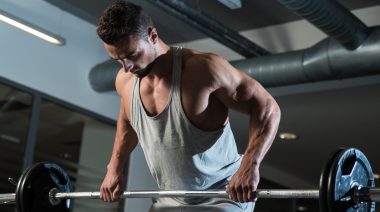 Man performing a barbell bent-over row.